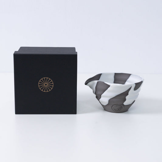 Japanese matcha bowl with spout "White Flow" pottery next to a black gift box with a gold chrysanthemum crest, made in Japan.