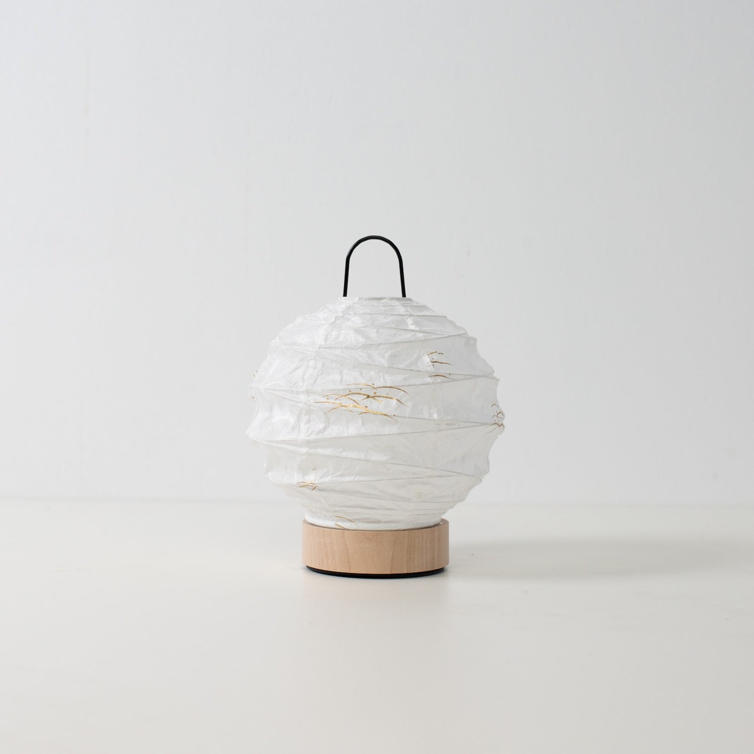 Japanese Paper Table Lamp "Yuhi" Rabbit, white, Mino Washi paper and wood - unlit round accent lamp from Japan on a white surface.