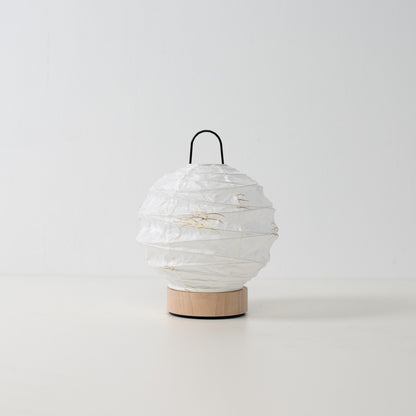 Japanese Paper Table Lamp "Yuhi" Rabbit, white, Mino Washi paper and wood - unlit round accent lamp from Japan on a white surface.