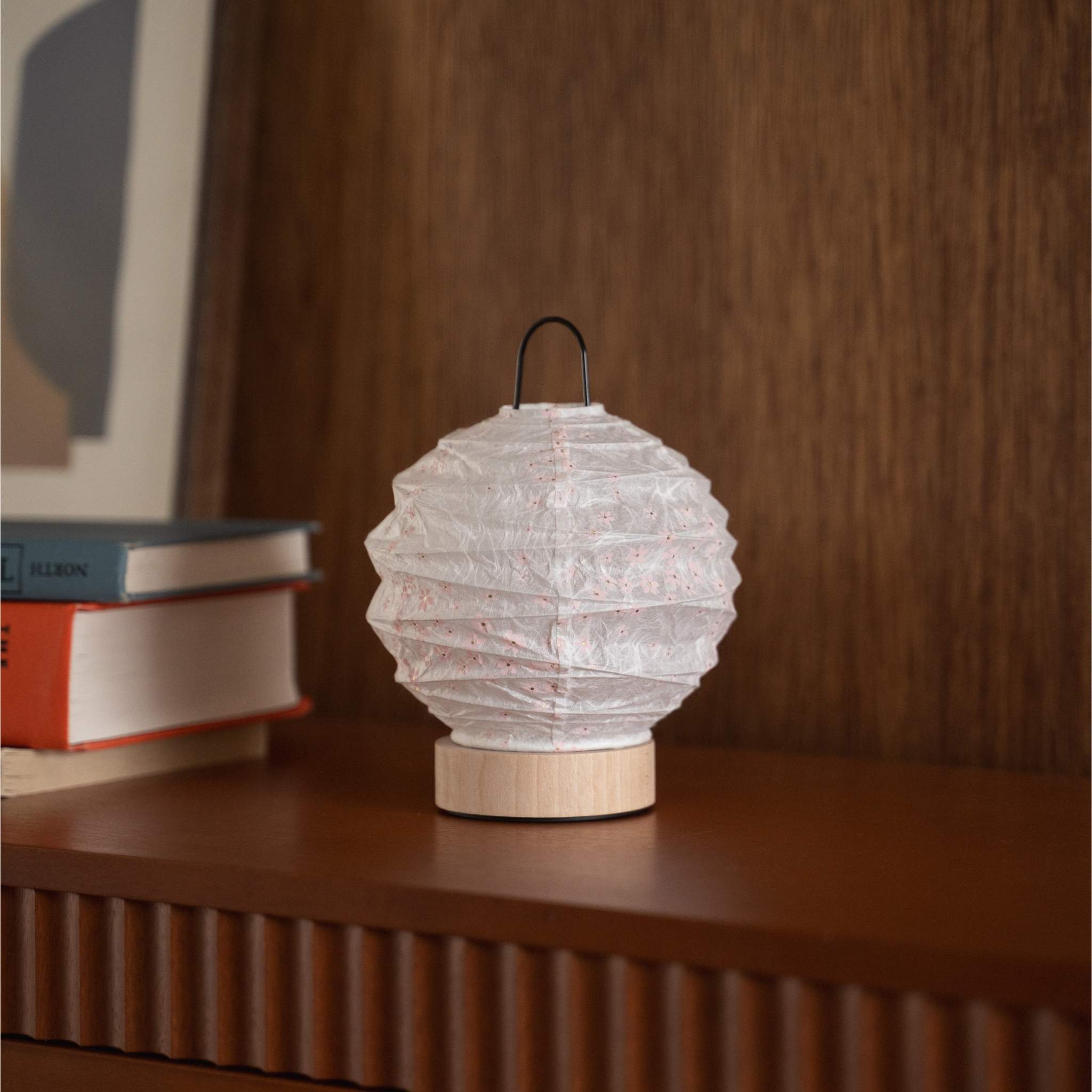Japanese paper table lamp "Yuhi" Sakura placed on a console table in a mid-century living room