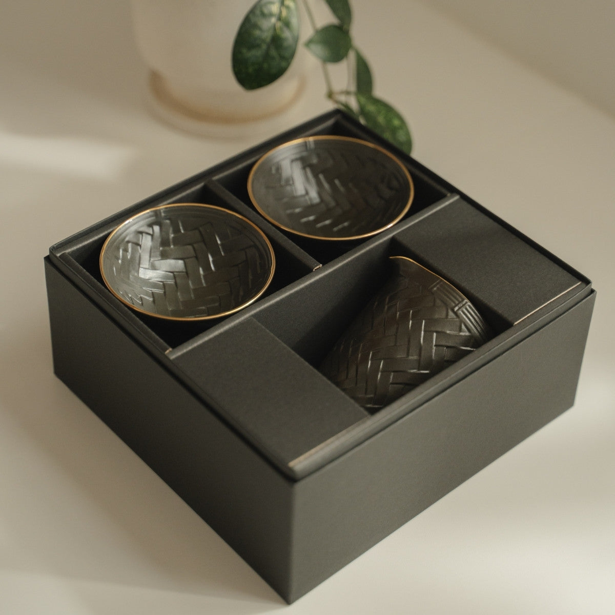 Black and gold arita porcelain sake set from Japan in a dark gift box, ready for sake lovers to gift.