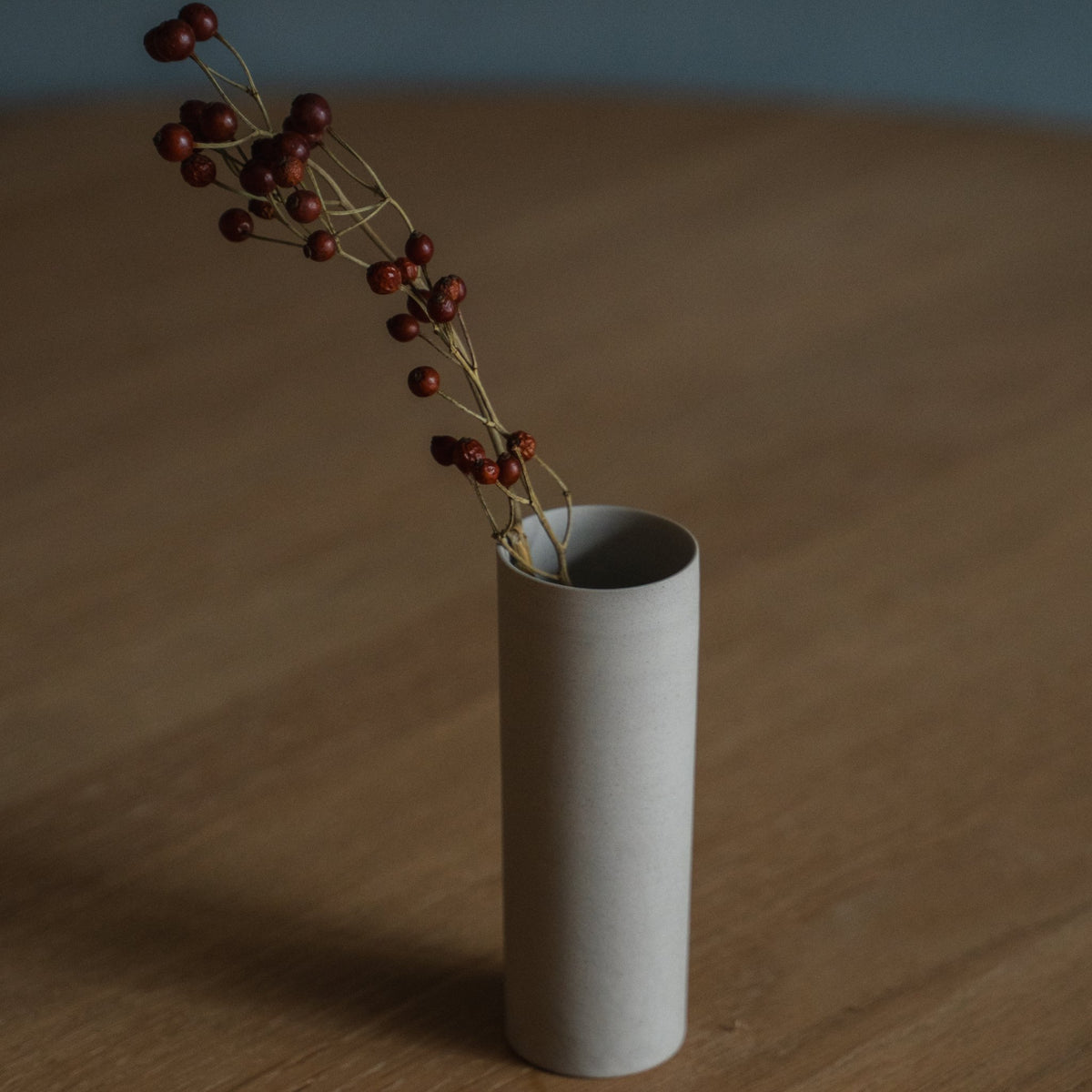 Japanese Single Flower Vase "Cylinder" in white styled in a styled room, detail lifestyle view.