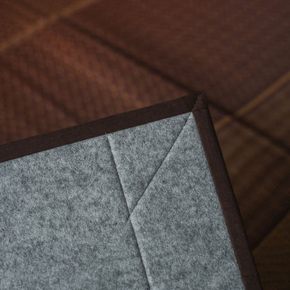Japanese burgundy rush tatami area rug showing its non-woven backing, providing a floor-safe base for modern rooms.