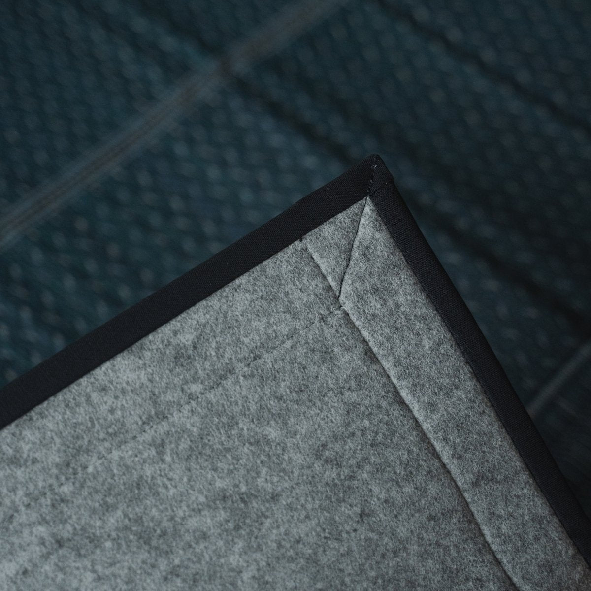 Japanese indigo navy rush tatami area rug revealing its non-woven backing, providing a floor-safe base for modern rooms.