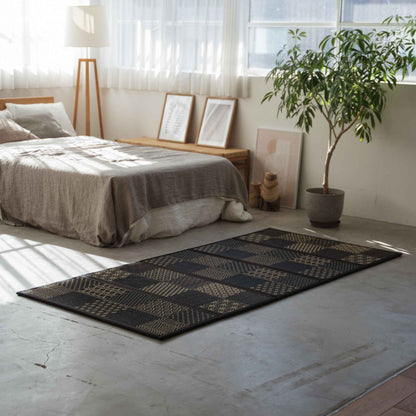 Five panel edokomon tatami mattress laid on a bedroom floor serving as a breathable and foldable base for a futon.