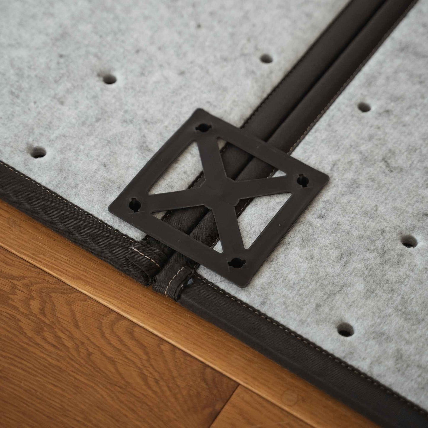 Close up of the back connector on a black square tatami mat showing how panels link for custom Japanese decor.
