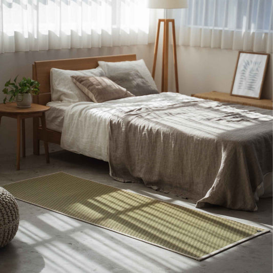Simple tatami mat placed on a sunlit bedroom floor creating a calm sanctuary for morning meditation.