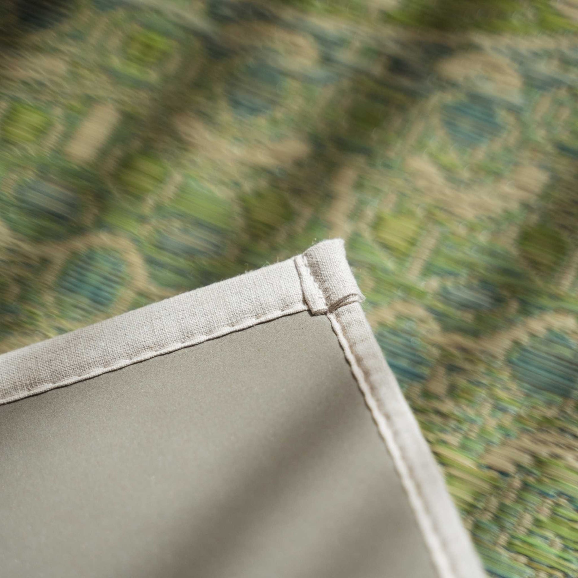 Corner detail of a green tatami yoga mat showing the eco friendly non slip TPE backing.