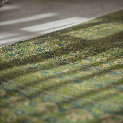 Close up of the green mandala design woven into a rush grass tatami mat for zen decor.