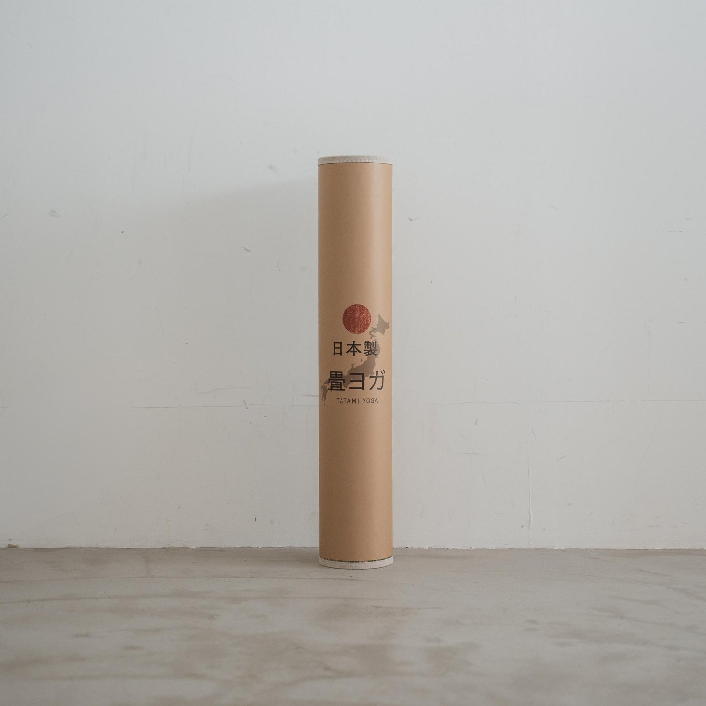 Standing rolled tatami mat showcasing woven rush grass texture and eco friendly design for modern japanese decor.