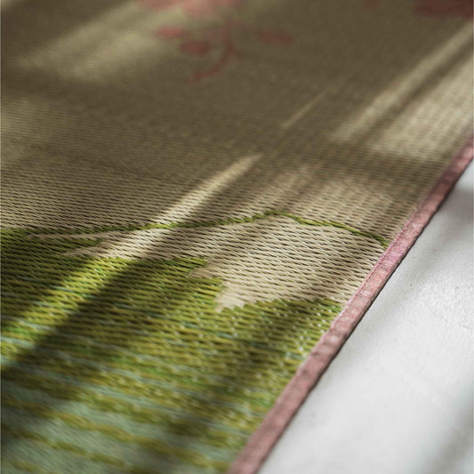 Close up of the rush grass texture on a tatami mat showing the intricate pink sakura weave pattern.