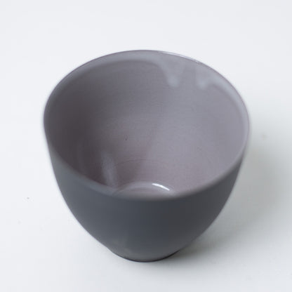 Close up inside f-shape japanese tea cups featuring glossy glaze designed to highlight tea color