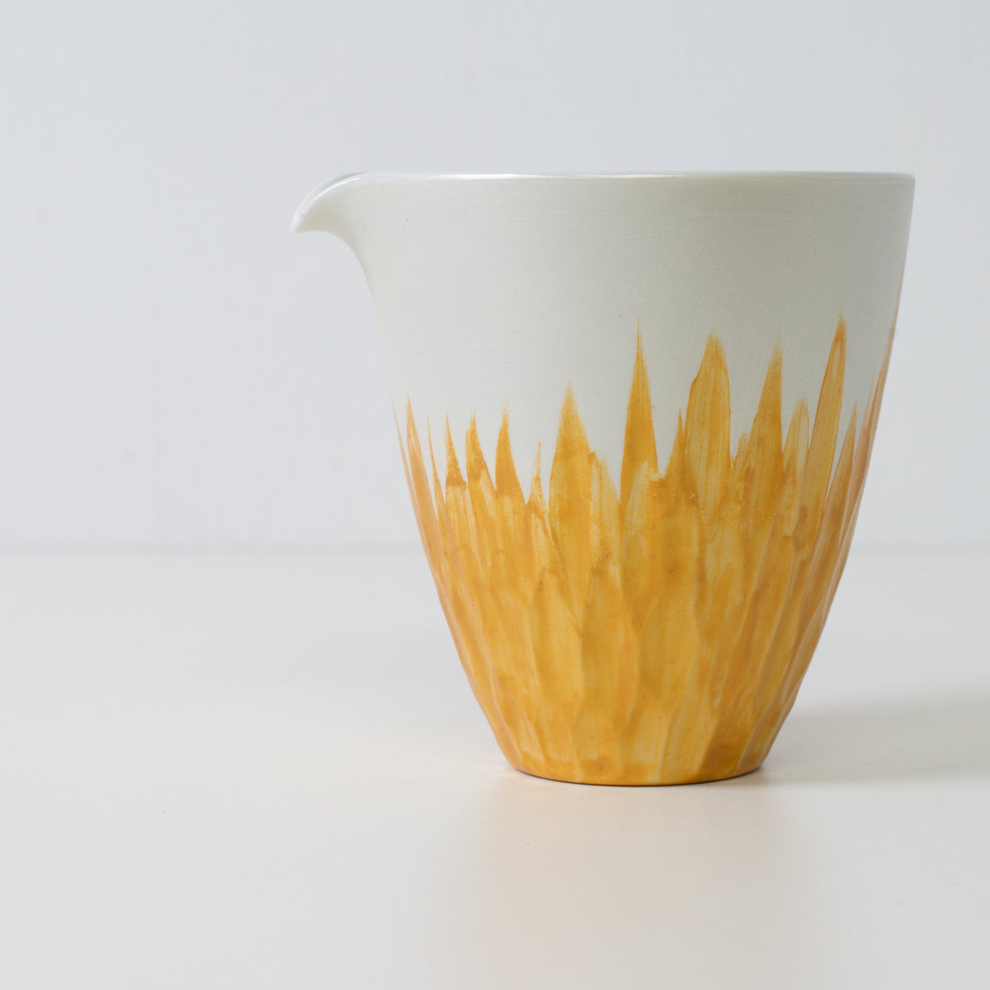 Gold floral sake carafe, white porcelain - Close up of a Japanese sake carafe with gold floral details