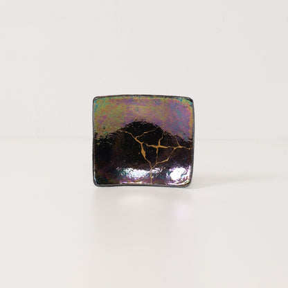 Shikkoku-rai iridescent luster kintsugi art plate 04, handcrafted Japanese pottery with gold repair lines and rainbow glow.