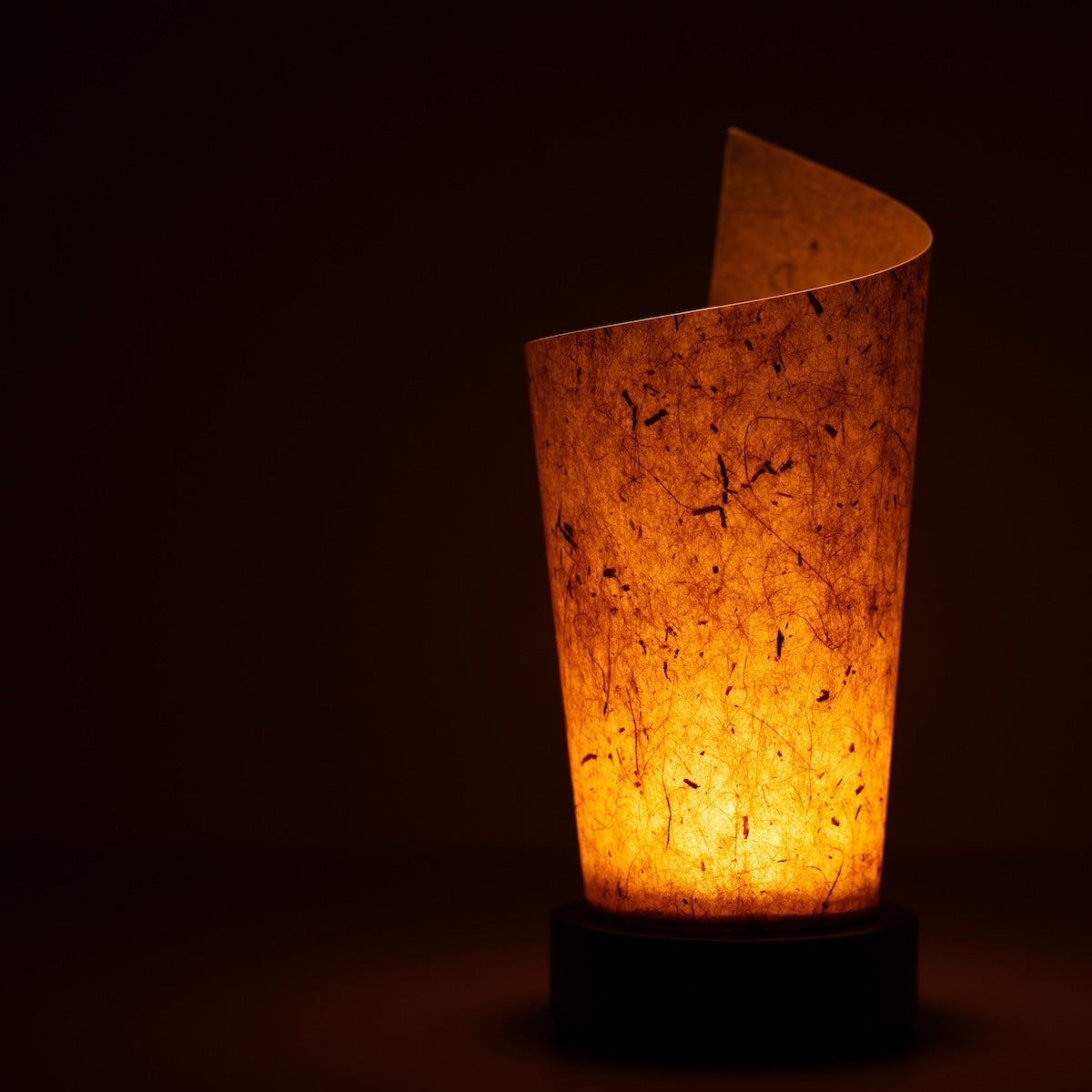 Japanese Paper Table Lamp "Maki" Cedar Bark, brown, Mino Washi paper - close-up of illuminated wabi sabi table lamp showing texture