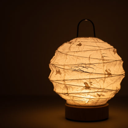 Japanese Paper Table Lamp "Yuhi" Rabbit, white, Mino Washi paper - close-up of illuminated wabi sabi table lamp showing texture.