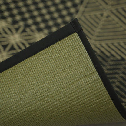 Corner of the Japanese Tatami Yoga Mattress "Ed Plain" Black lifted to show the textured PVC backing and black border.