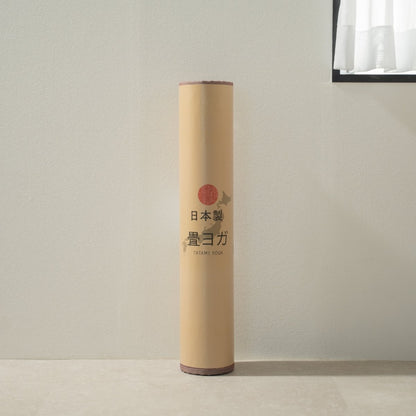 Packaged Japanese Tatami Yoga Mattress "Marble" Pink standing in a minimal room, ready for your home yoga practice.