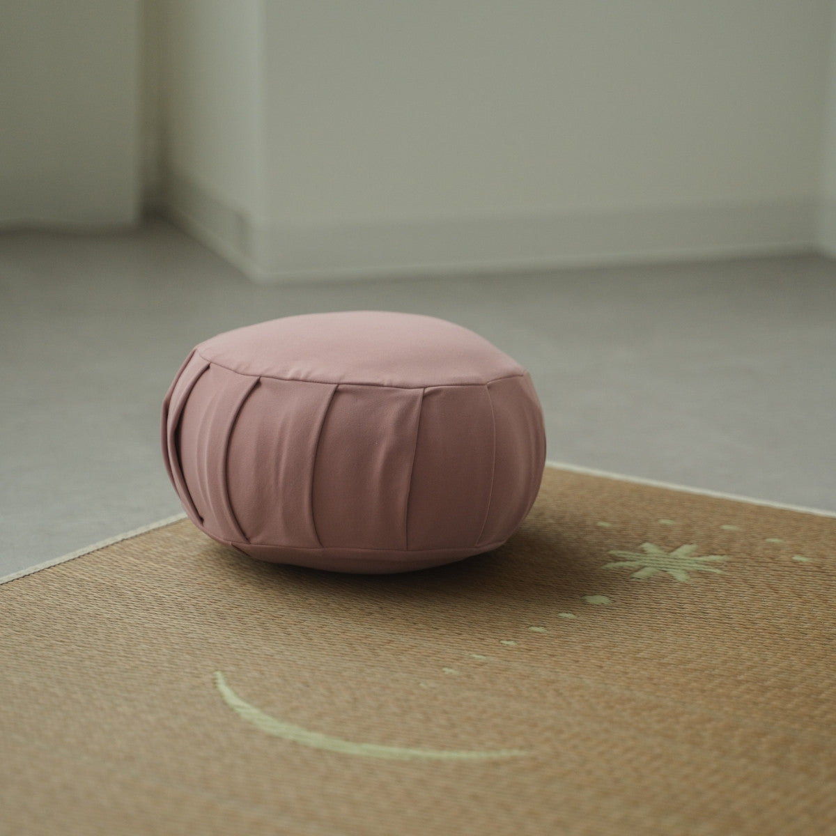 Rose Japanese meditation cushion zafu, placed on a tatami mat in a Japandi style room for a daily zen routine.