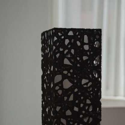 Close up detail of the black Melook paper texture with web like Kozo fibers on the Me Look 01 lamp shade.