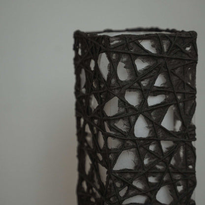Detail of black Me-look paper texture showing web like Kozo fibers entwined on the Me Look 02 lamp shade.