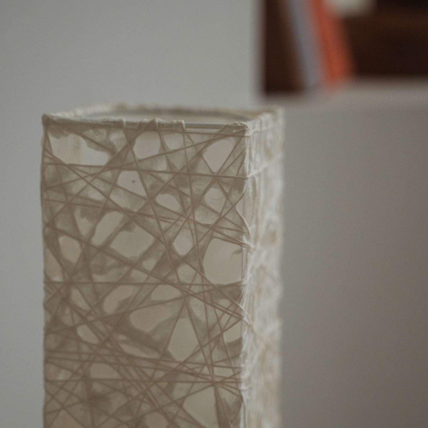 Detail of white Me-look paper texture showing web like Kozo fibers entwined on the Me Look 02 lamp shade.