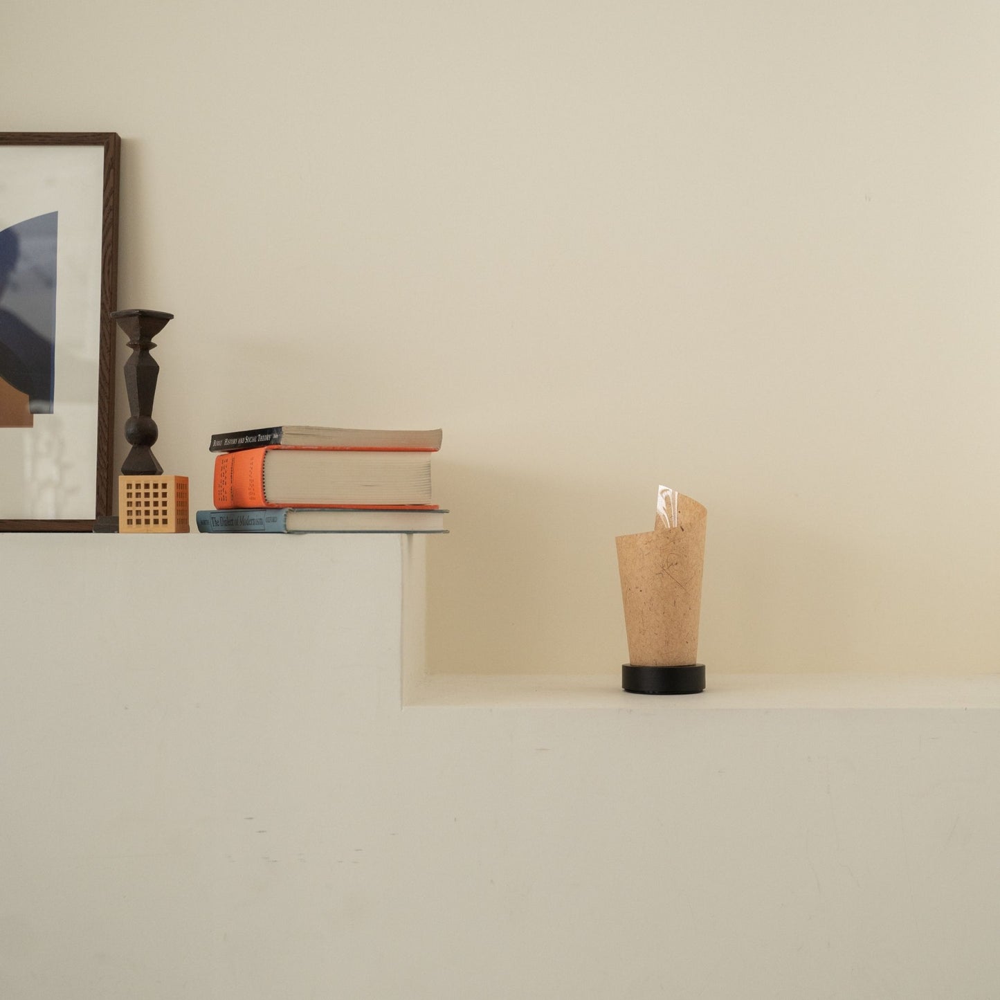 Unlit Japanese paper table lamp "Maki" Cedar Bark with rustic flecks on a white console table in a Japandi living room.