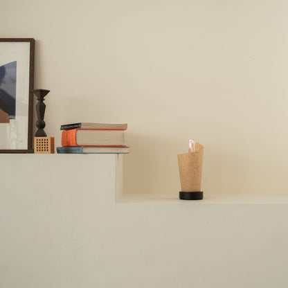 Unlit Japanese paper table lamp "Maki" Cedar Bark with rustic flecks on a white console table in a Japandi living room.