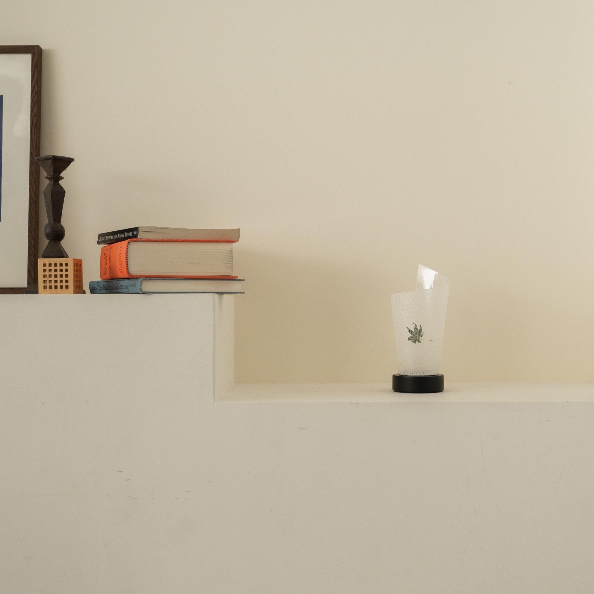 Unlit Japanese paper table lamp "Maki" Momiji Leaf with rustic flecks on a white console table in a Japandi living room.