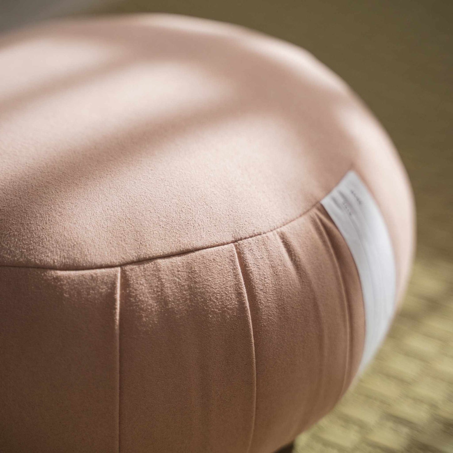 Close up of smoky rose zafu meditation cushion showing the high quality fabric texture and firm shape.